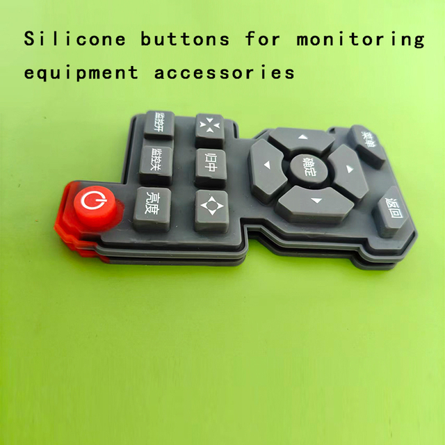 Silicone buttons for monitoring equipment accessories